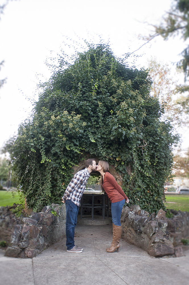 Portrait of the engaged couple during their engagement session sharing a kiss at Monmouth University.