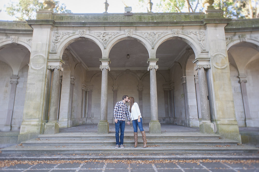 Engaged couple sharing a kiss at their college Monmouth University.